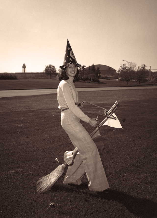 A witch with her modern handlebar broom.